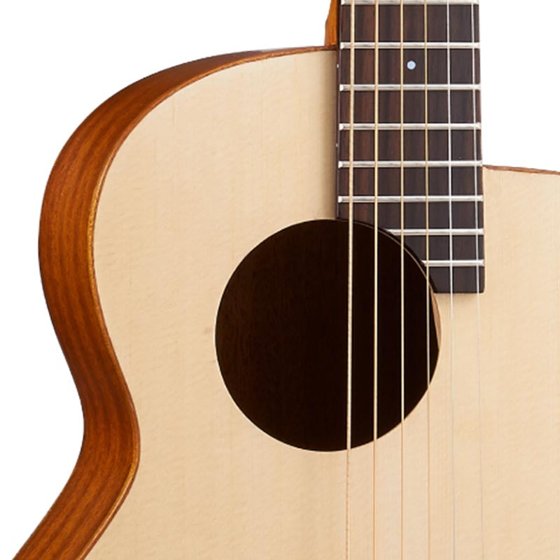 Close-up of a acoustic guitar with a white background