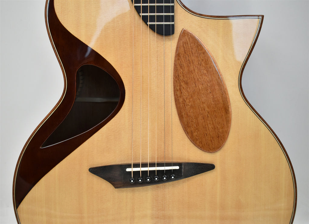 Unique sculpted cutaway design acoustic guitar close-up