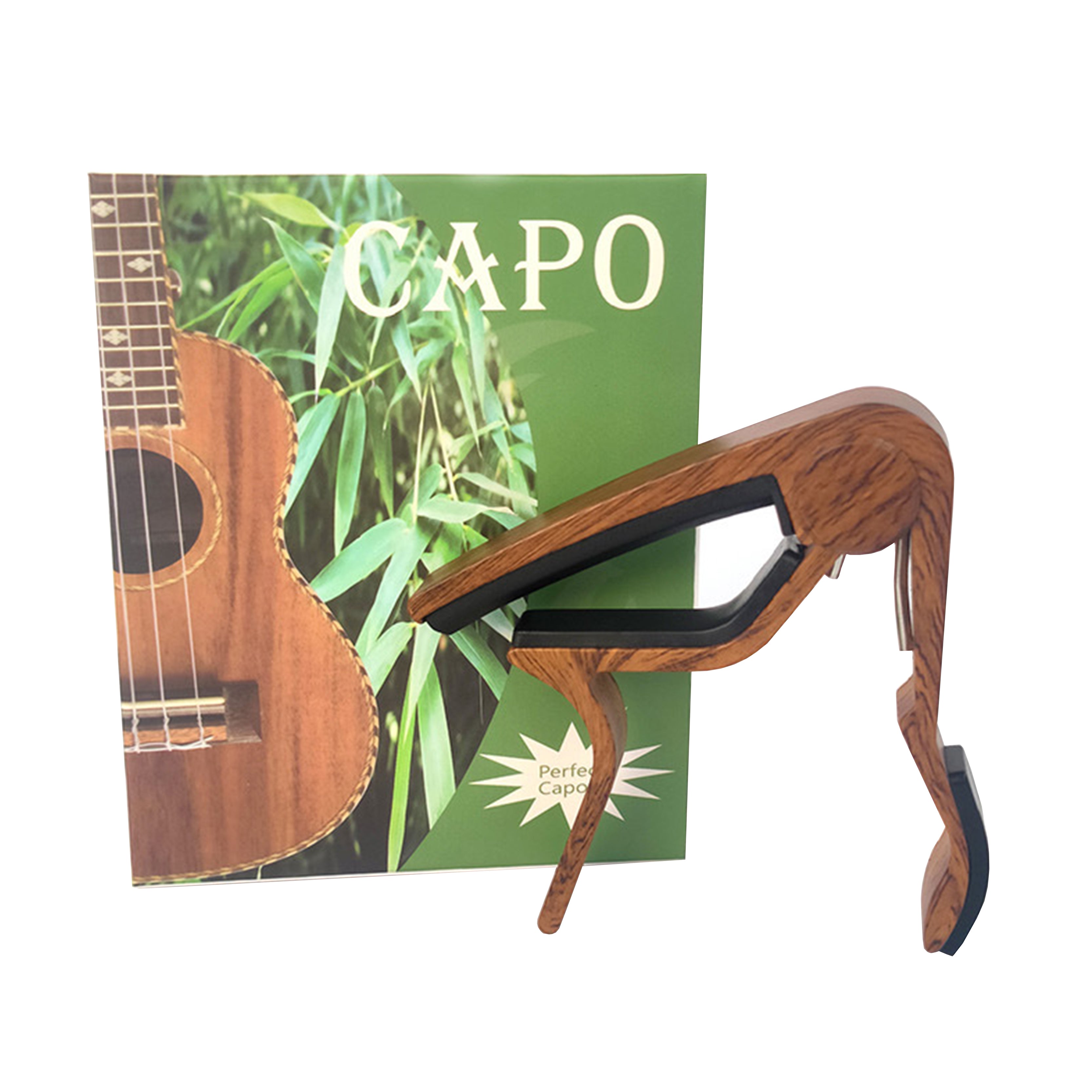 Wooden guitar capo with a green box featuring an image of a guitar and the word 'Capo'.