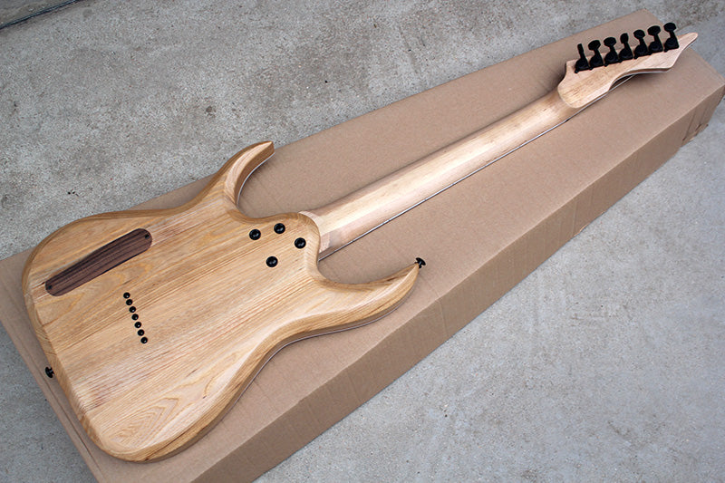 back side of the 7-string electric guitar with natural finish is hshown on the photo.