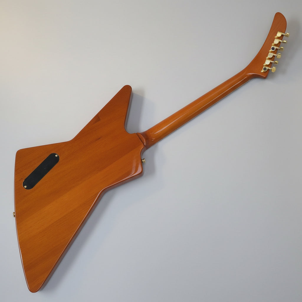 Wooden guitar with a unique body shape on a white background