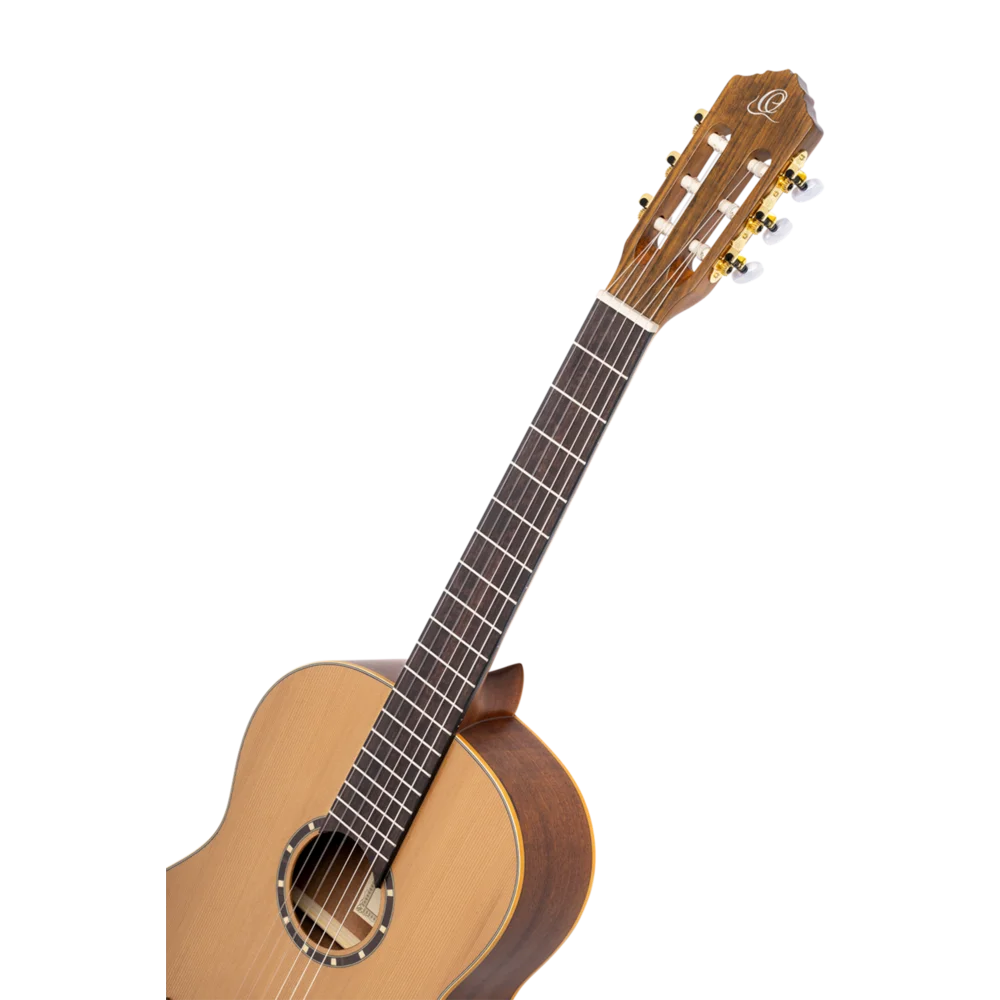 Left-handed classical guitar body detail showing sound hole, cedar top and walnut bridge, Sydney guitars
