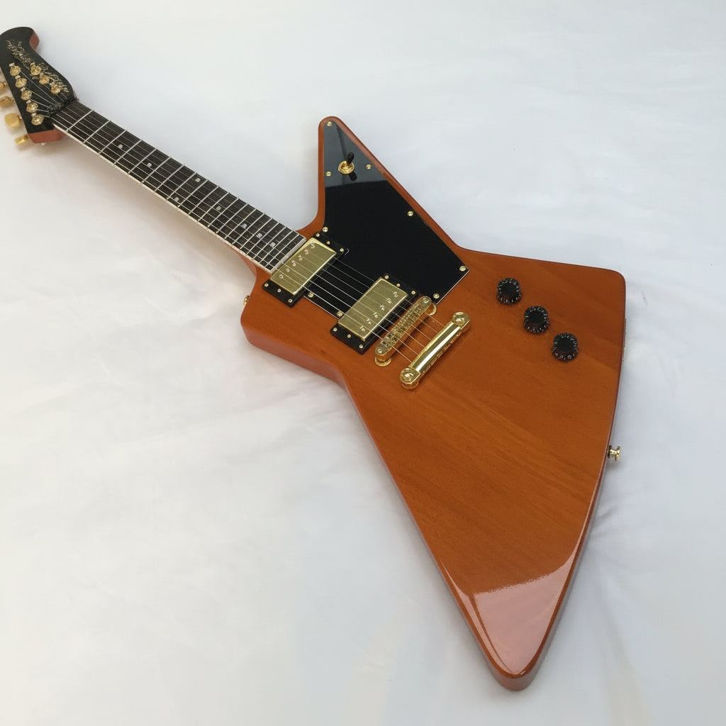 Wooden electric guitar with a unique design on a white background