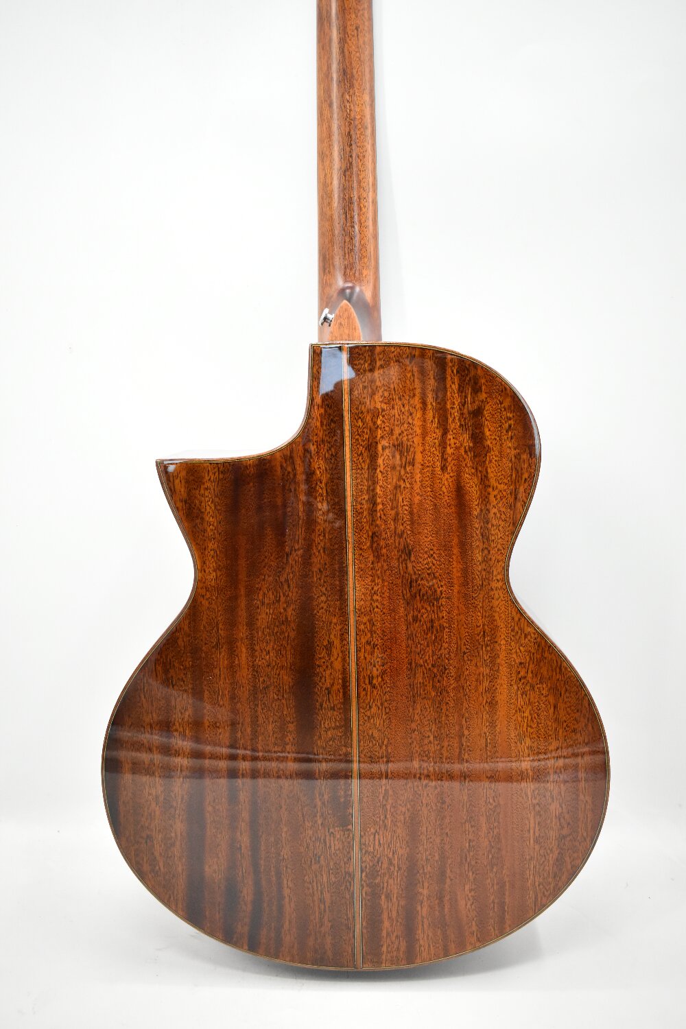 Mahogany-back acoustic guitar with deep, rich wood grain and a high-gloss finish, offering warm midrange tones and strong projection. Ideal for musicians wanting a premium, well-crafted acoustic guitar available for fast delivery across Australia.