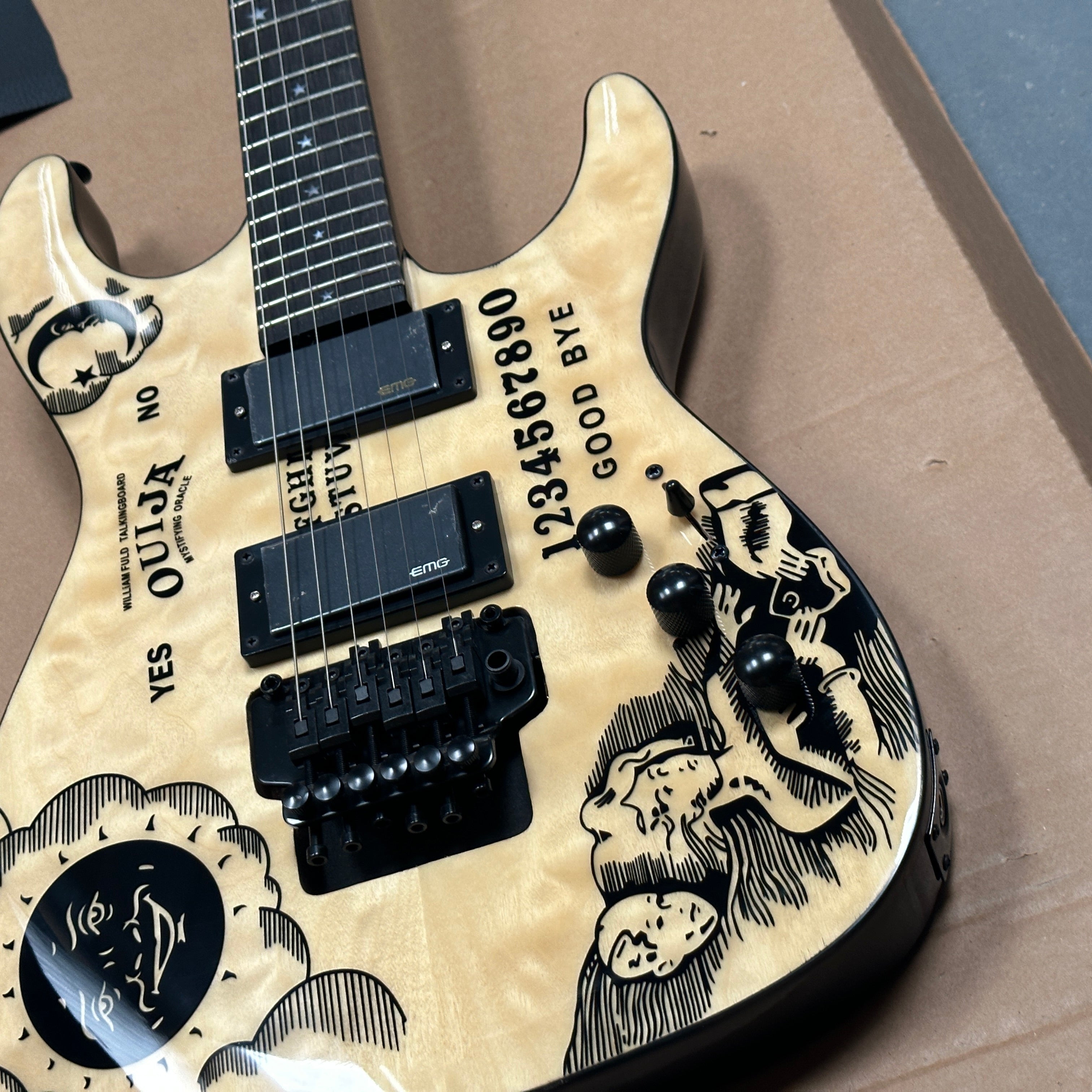 Electric guitar with black and white designs on a beige background