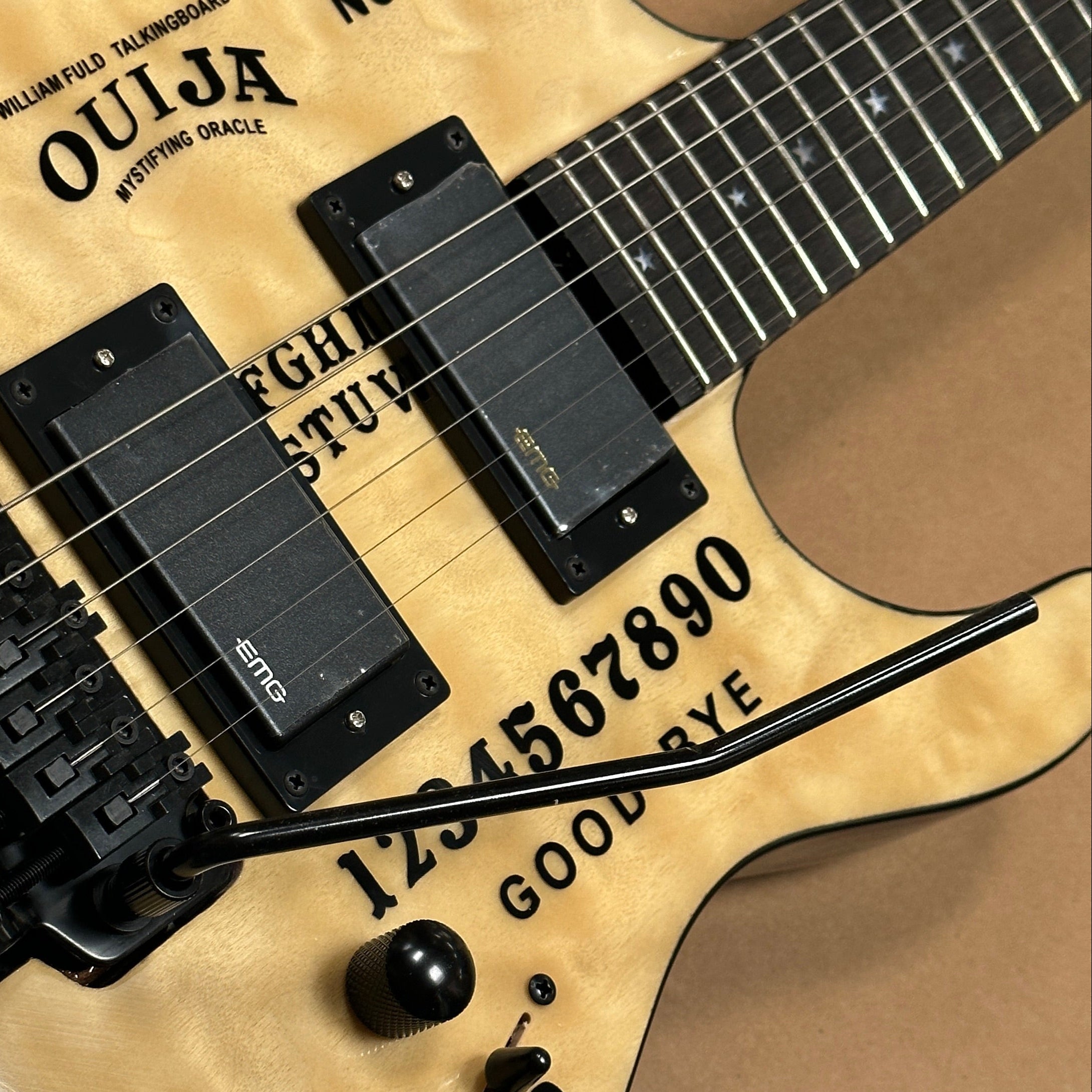 Electric guitar with Ouija board design on the body. fancy looking electric guitar with steel strings shown on the photo.